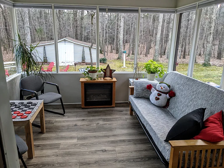 Sunroom decorated for the winter season.