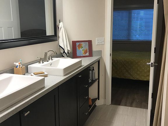 Master bathroom with a jacuzzi tub and walk-in closet 