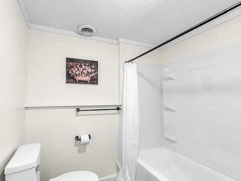 Bathroom A located on the basement level features a shower/tub combo.