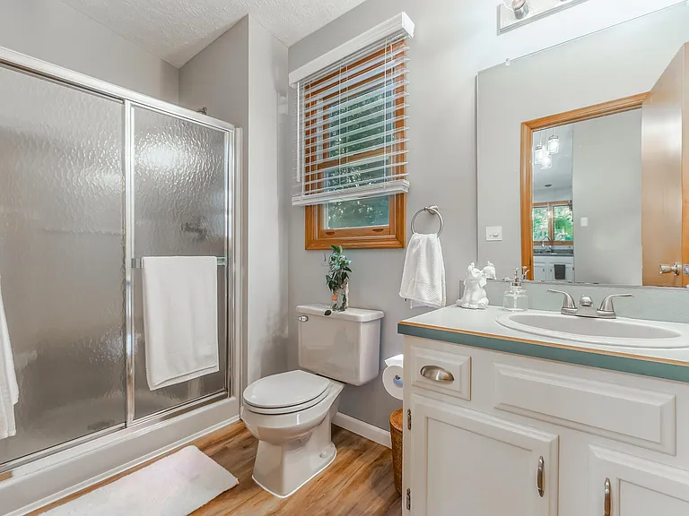 Bathroom off the garage entry area next to the kitchen