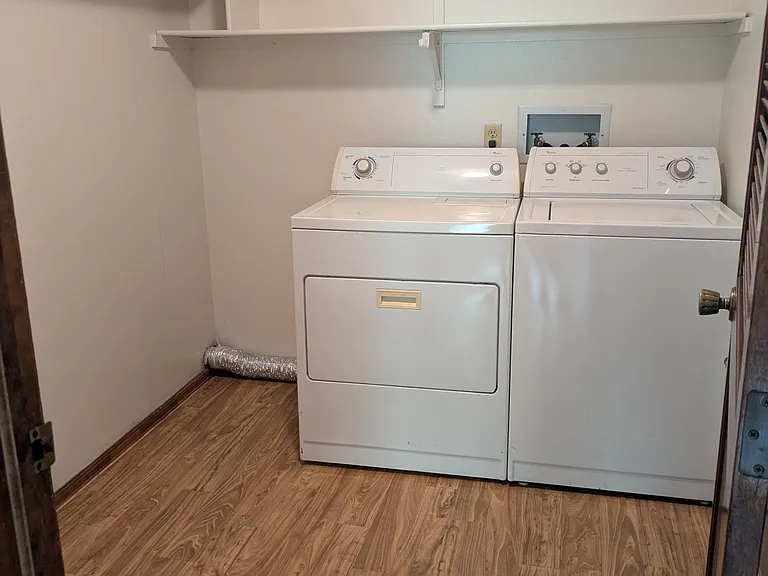 Spacious laundry room with space for more storage/pantry