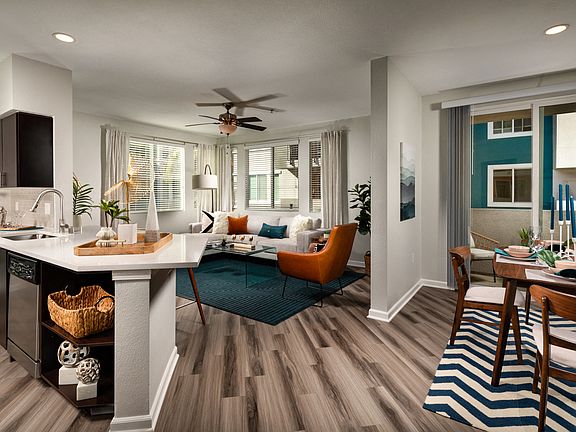 Dog-Friendly Apartments in La Mesa CA - The District - Spacious Living Room and Kitchen with Wood-Style Flooring