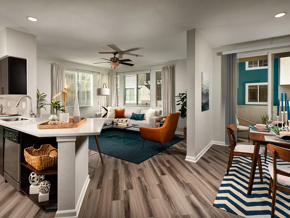 Dog-Friendly Apartments in La Mesa CA - The District - Spacious Living Room and Kitchen with Wood-Style Flooring