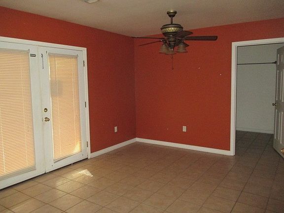 dining area with French door to patio, laundry room door on right