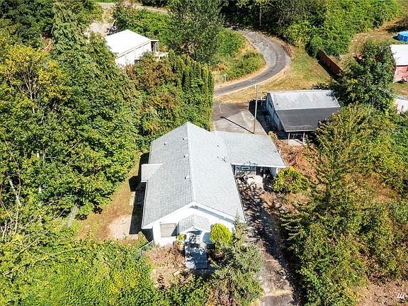 Nestled among the trees sits this cute craftsman home with carport just waiting for it's refresh or complete remodel into your perfect estate!>