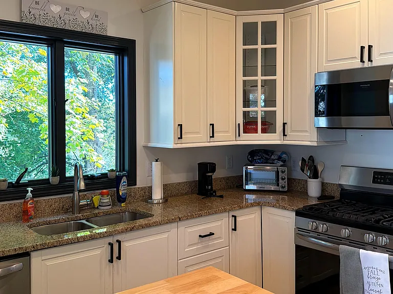 Kitchen with granite countertops, newer appliances, Also included, pots and pans, dishes, utensils, toaster over,