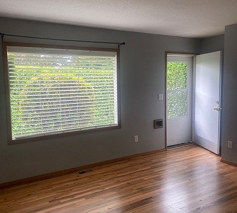 Large front window greets you in the living room, providing natural light.