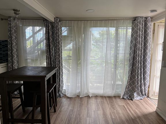 Abundant light with floor to ceiling windows.