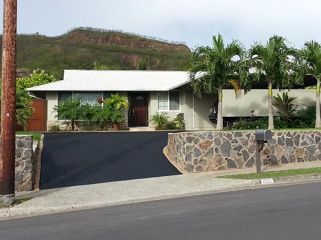 This photo will be updated, the trees are a lot taller now and the coating on the driveway is not as dark.