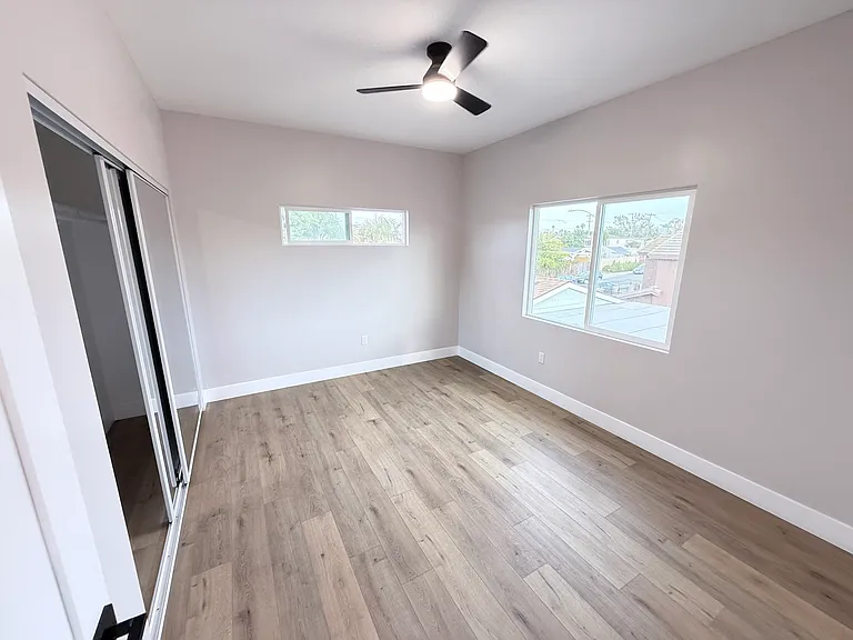 Large bedroom. Can accommodate a King-sized bed. Ceiling fan with remote and dual directional air flow.