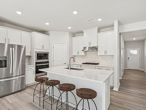 Kitchen in the Chatham floorplan at a Meritage Homes community in Garner, NC.
