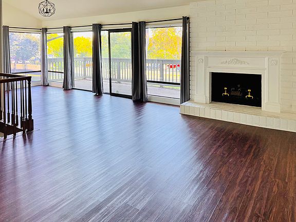 Living room and dining room. Dining room looks out to park.