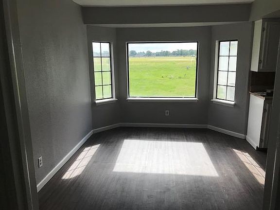 Remodeled dining room just off kitchen. Beautiful bay window view of expansive back yard, exercise trail and sod farm.