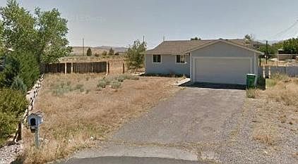 This is an older picture. The outside of the house was painted for years ago. The weeds have been cut down. Rock Was laid down o