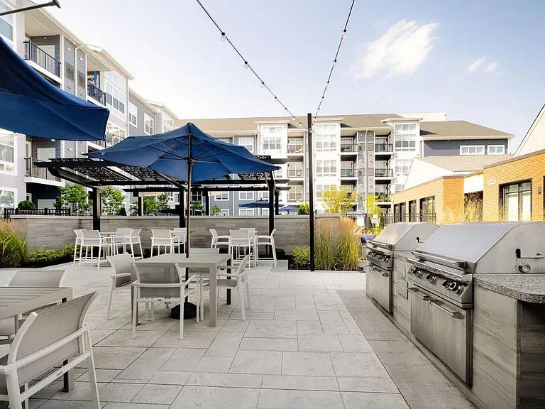 Courtyard with BBQ grills and picnic seating