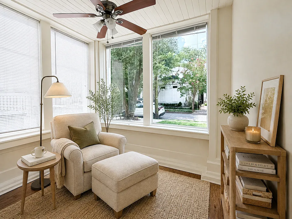 Sunroom set up as reading nook. **Photo shows the apartment furnished Apartment is rented unfurnished; furniture and decor are not included.