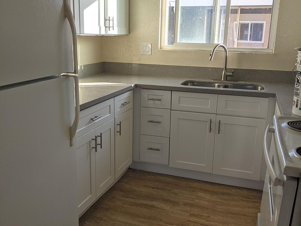 Kitchen with electric stove, new cabinets and quartz counter tops