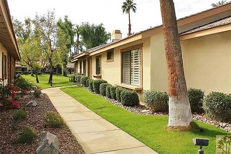 View of the exterior side of the home and common area.
