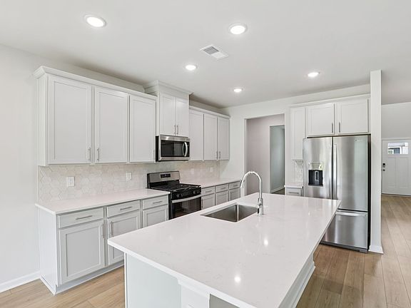 Kitchen in the Johnson floorplan at a Meritage Homes community in Angier, NC.