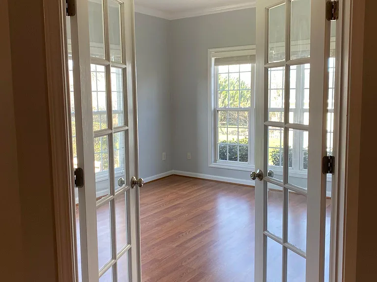 The adjacent bedroom can be used as guest room, play area or office. French doors provide privacy.