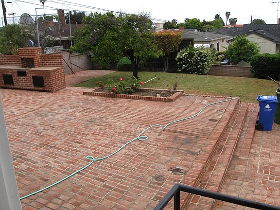 Backyard - photo taken from back door steps, peek-a-boo view of harbor/ocean when sky is clear