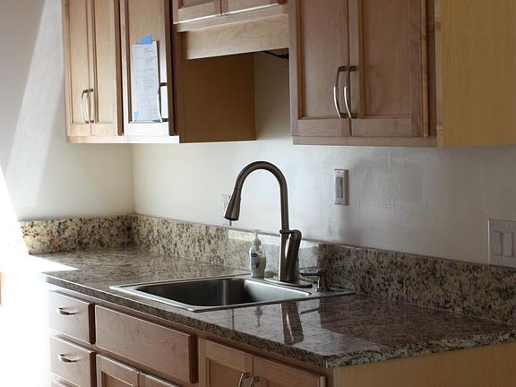 Kitchen - maple wood cabinetry with solid granite counter tops
