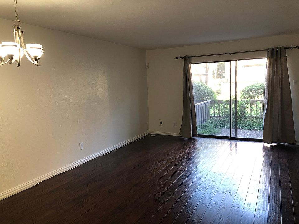 Downstairs living room opens to fenced patio