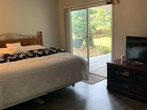Master bedroom with ensuite bathroom and large walk-in closet.