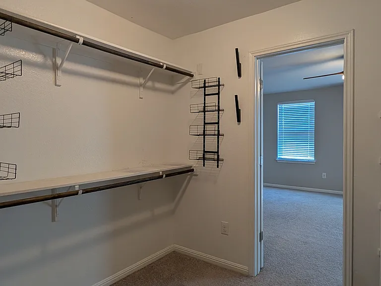 Walk-in closet in primary bedroom