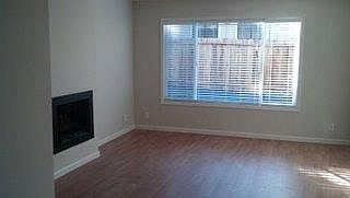 Living Room looking out to building driveway