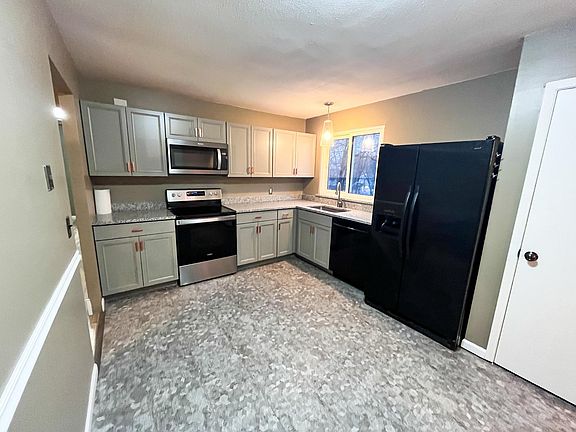 New cabinets, granite countertops, flooring, stove and microwave