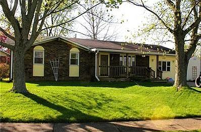 Exterior Front. Brick exterior on corner lot with mature trees.