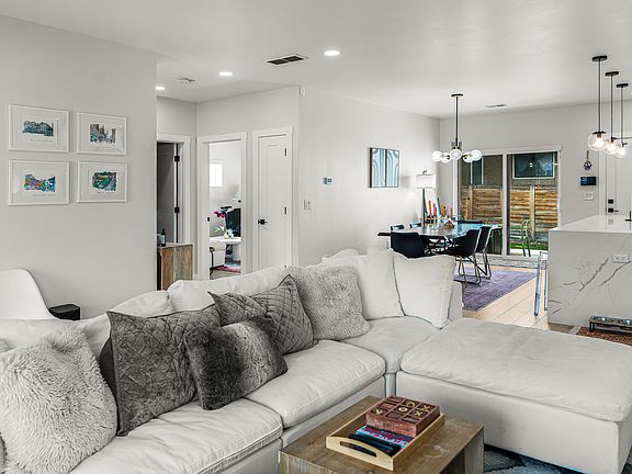 Bright living space with tall ceilings and seamless flow for everyday living