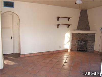 Family Room w/ Fireplace & Saltillo Tile