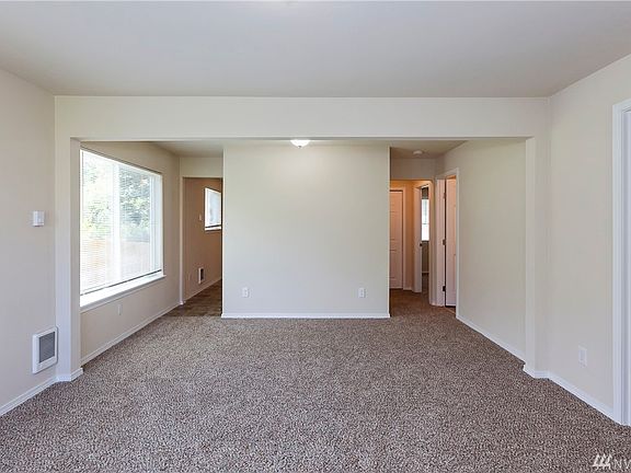 Bedroom 1 on the right. Bathroom and Master down the right hallway. Kitchen through the left hallway