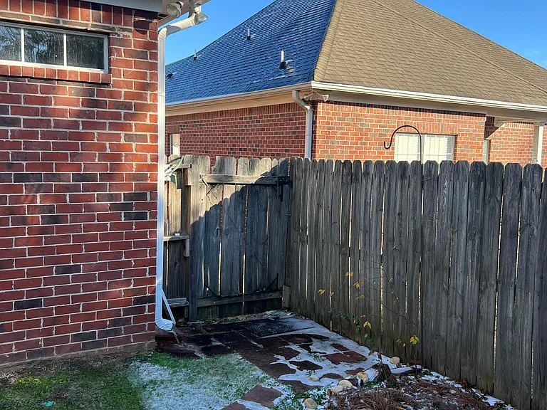 Right side of backyard with gate.