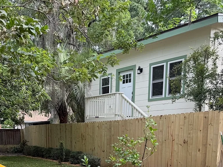 This house is private and secluded and surrounded with a full privacy fence.