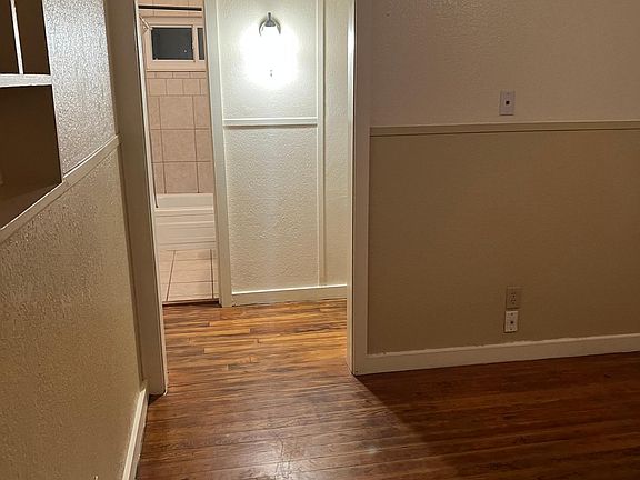 Living room view to bathroom from front door of house