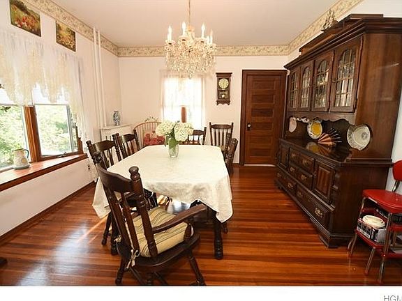 Formal dining room leads to living room and kitchen.