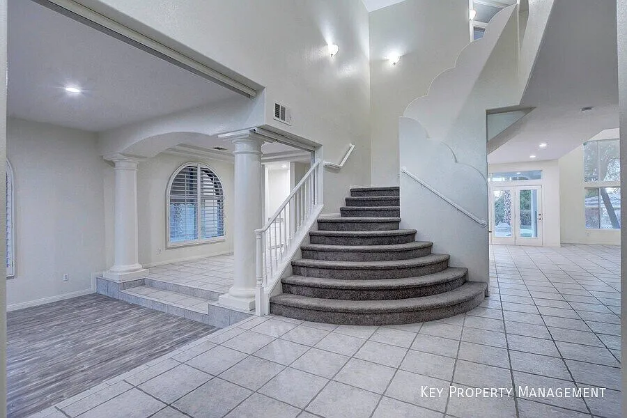 Guard-Gated Luxury in The Grand Legacy: 5-Bed Golf Course Home with Waterfall Pool — Photo 4