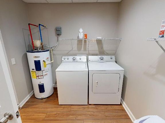 Shared laundry space between both units separated by locked door.