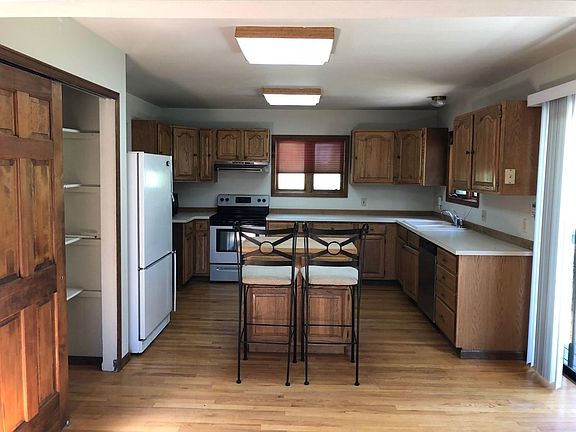 Large pantry closet and patio slider to side deck