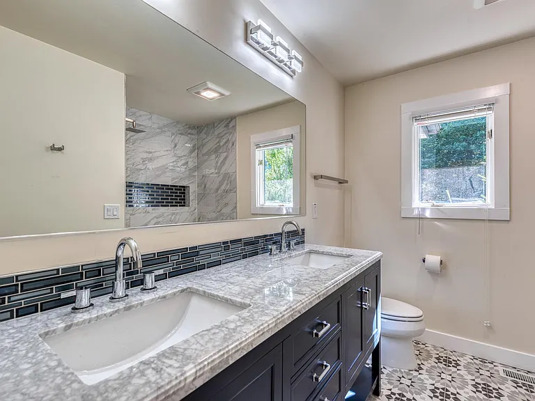 Hallway bathroom upstairs with double vanity sink!