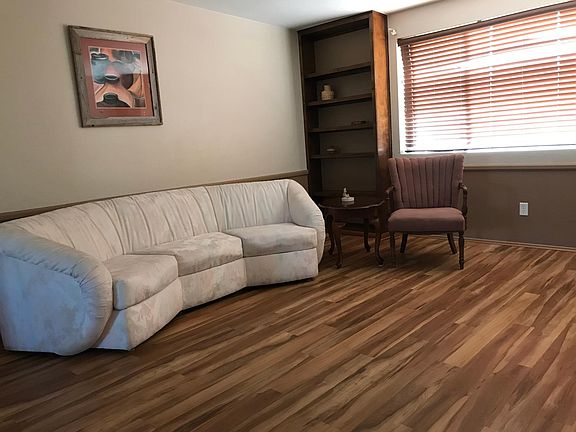 Living room looking toward the south facing picture window to the backyard