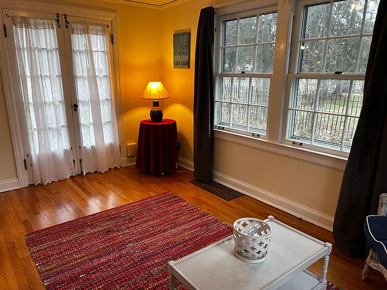 Sunroom/den with half bath to side