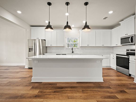 Stunning kitchen with large granite island