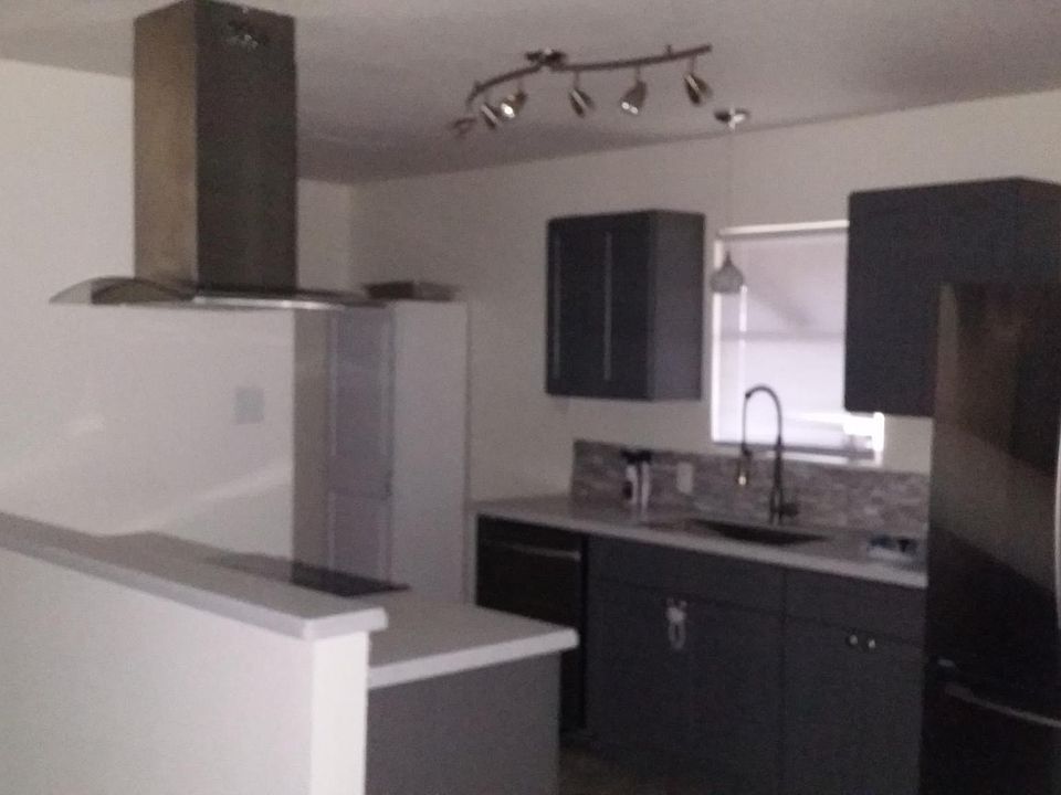 Closer view of kitchen.