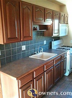 Kitchen with Cherry Merrillat cabinets and Ceramic