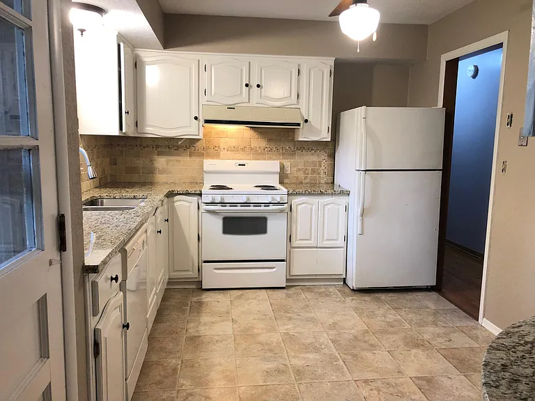 Kitchen with granite countertops.