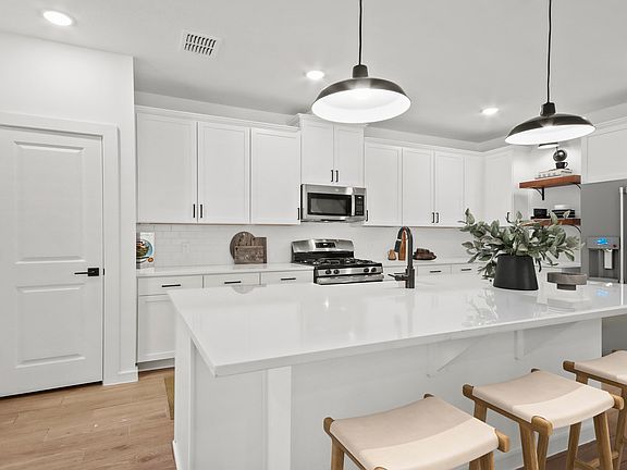Kitchen with center island and pendant lighting